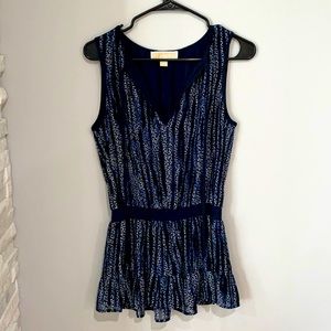 Michael kors XS top. Never worn but tags have been removed.